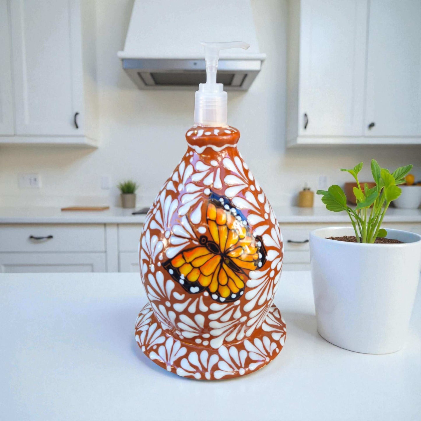 Talavera Butterfly Soap Dispenser | Hand-Painted Ceramic hand-painted orange butterfly ceramic soap pump on kitchen counter