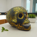 Talavera Calavera Skull | Hand-Painted Ceramic Decor black skull with intricate gold floral motifs, handcrafted in Guanajuato, Mexico