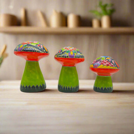 Talavera Mushroom Set | Vibrant Hand-Painted Mexican Decor - trio of brightly painted hand-painted Talavera ceramic mushrooms on wooden table