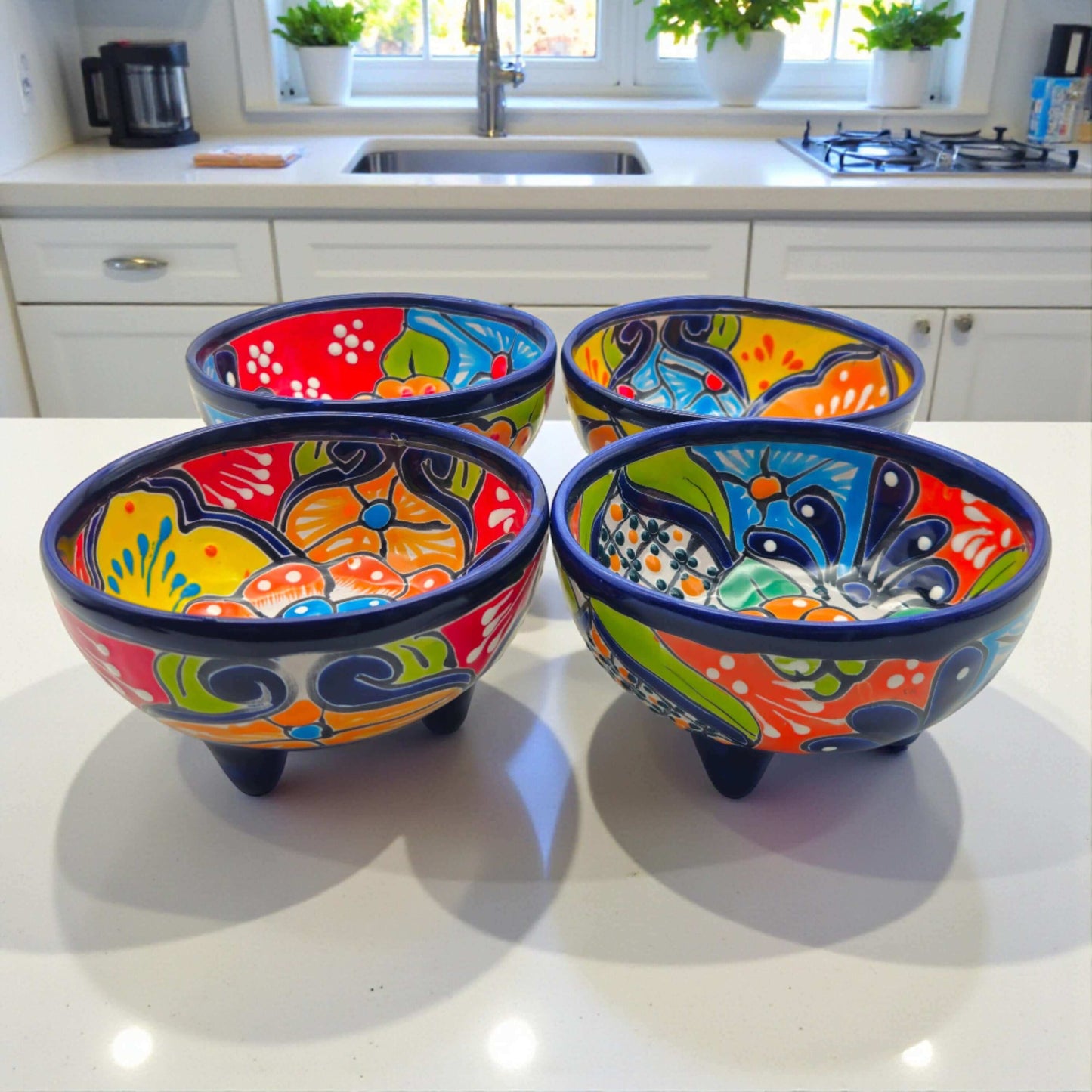Talavera Salsa Bowl | Handcrafted Mexican Molcajete with vibrant hand-painted orange green blue designs on three-legged ceramic molcajete base