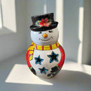 Talavera Snowman Figurine | Festive Hand-Painted Holiday Art cheerful hand-painted Talavera snowman with black hat, star cutouts, yellow scarf, bright colors