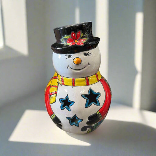 Talavera Snowman Figurine | Festive Hand-Painted Holiday Art cheerful hand-painted Talavera snowman with black hat, star cutouts, yellow scarf, bright colors