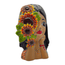 Angled front view of a colorful Talavera lady face planter with sunflower decoration