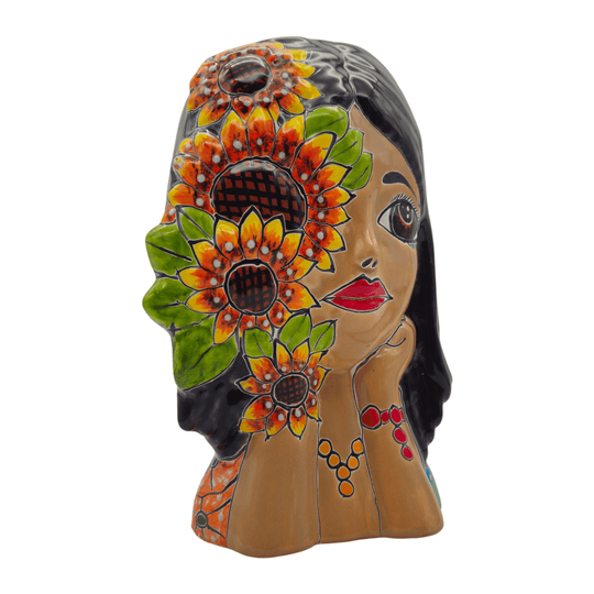 Angled front view of a colorful Talavera lady face planter with sunflower decoration