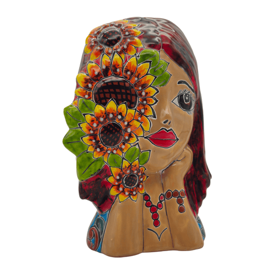 Front view of a Talavera lady face planter with sunflower artwork and red hair