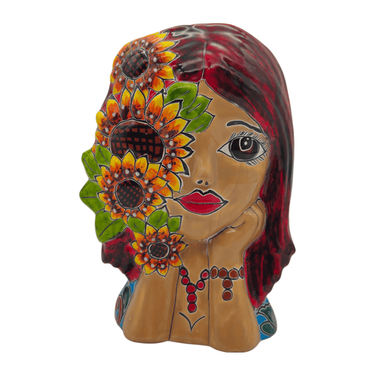 Three-quarter view of a Talavera lady face planter with hand-painted sunflower details