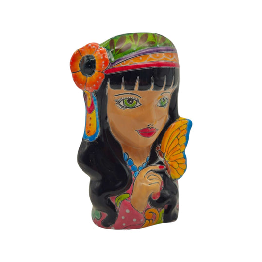 Detailed front view of Talavera lady head planter holding a butterfly