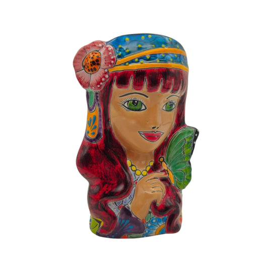 Front view of Talavera lady head planter with butterfly accent and black hair