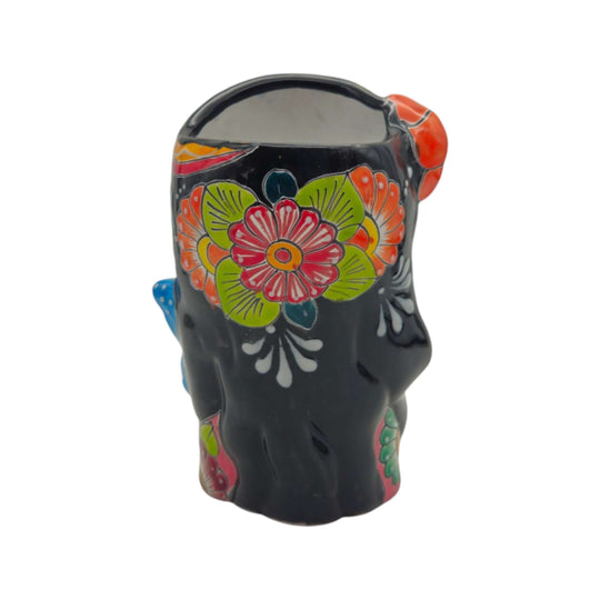 Front view of Talavera lady head planter with butterfly accent and red hair
