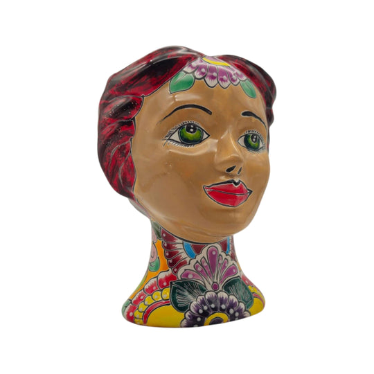 Side angle of a Talavera lady head planter with floral neck decoration