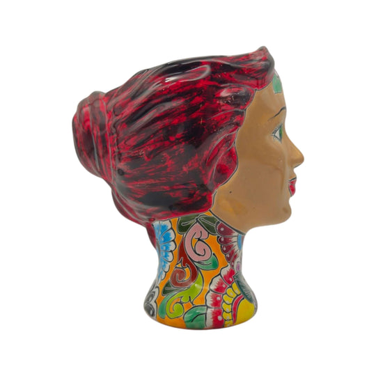 Side profile of a Talavera lady head planter with red hair and floral decoration
