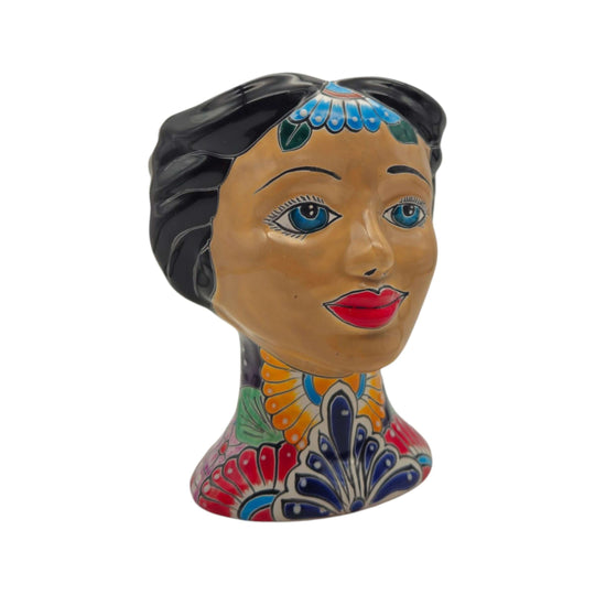 Three-quarter view of a colorful Talavera lady head planter on a white background