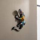 The Talavera Hub colorful ceramic lizard figurine with hand-painted floral patterns and skeletal details, Day of the Dead decor.