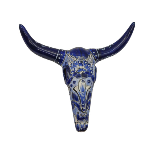 Close view of blue and white patterned Talavera longhorn skull wall art