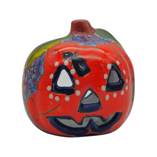 Front view of a red and orange Talavera Jack-O'-Lantern statue with blue accents