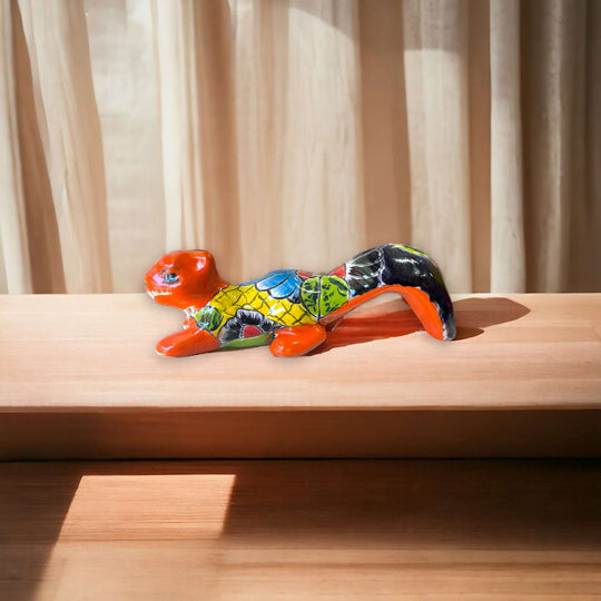 Talavera Squirrel Statue | Colorful Hand-Painted Mexican Figurine — hand-painted red and multicolor floral Talavera squirrel with raised tail on wooden shelf