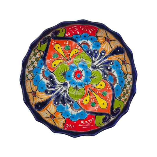 Top view showing the floral pattern inside a Talavera scalloped bowl
