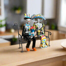 Talavera Skeleton Couple on Bench | Day of the Dead Mexican Decor hand-painted Talavera skeleton couple sitting on a wrought iron bench