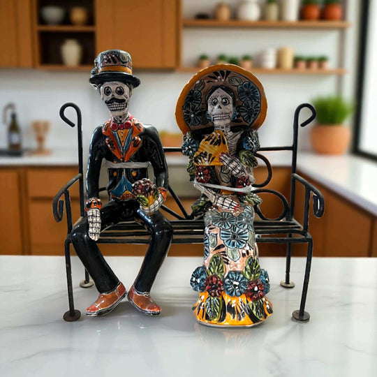Talavera Skeleton Couple on Bench | Day of the Dead Mexican Decor hand-painted Talavera skeleton couple seated on wrought iron bench