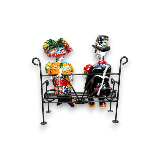 Talavera Skeleton Couple on Bench | Day of the Dead Mexican Decor - hand-painted Talavera skeleton couple seated on wrought iron bench