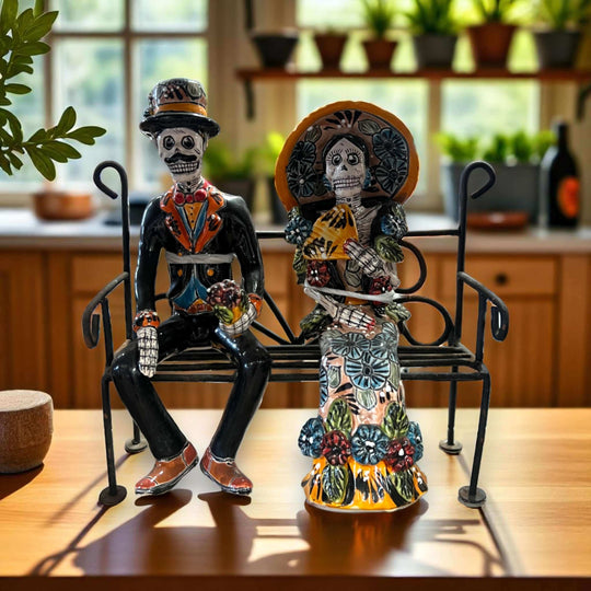 Talavera Skeleton Couple on Bench | Day of the Dead Mexican Decor - hand-painted Talavera skeleton couple seated on wrought iron bench