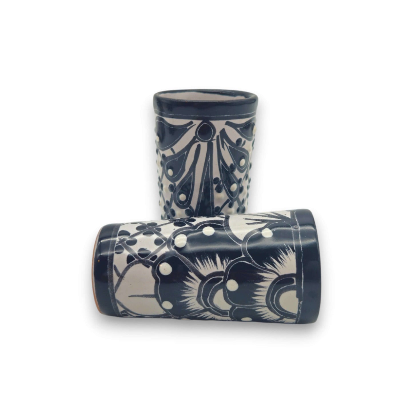 Talavera Skull Decanter with 6 Shot Glasses | Mexican Bar Set - two hand-painted black and white Talavera shot glasses with floral motifs