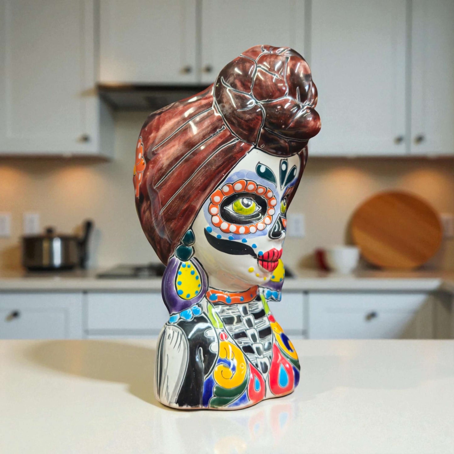 Talavera Skull Lady Planter | Colorful Day of the Dead Art hand-painted ceramic skull lady planter with vivid red blue yellow green patterns