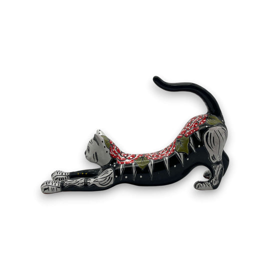 Talavera Stretching Cat Figurine | Hand-Painted Calavera Art - black hand-painted Talavera cat stretching with red floral and white skeletal accents