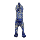 Rear view showing floral patterns on a blue and white Talavera cat statue