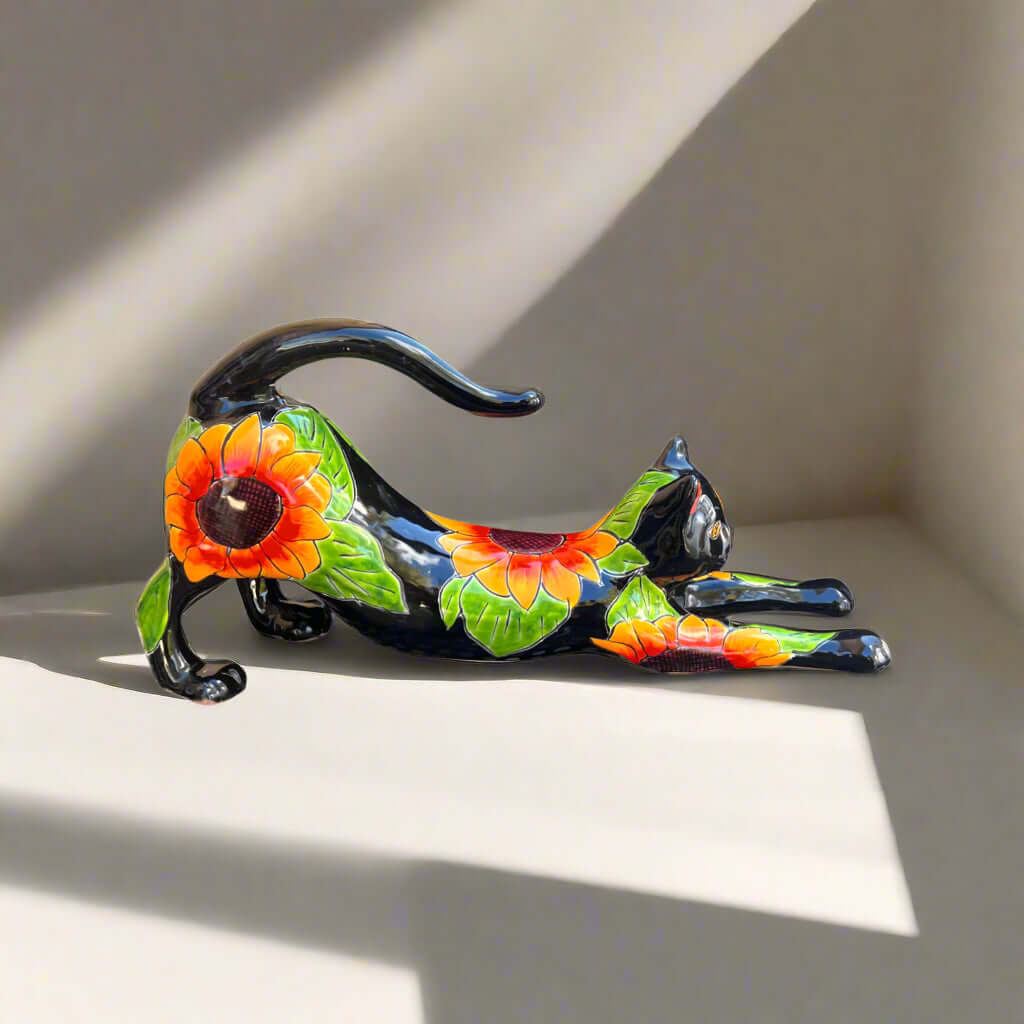 Talavera Stretching Cat Statue | Hand-Painted Sunflower Design - hand-painted black Talavera cat with vibrant sunflower motifs, handcrafted in Guanajuato, Mexico