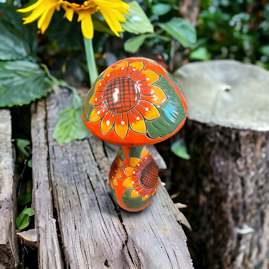 Talavera Mushroom Trio | Hand-Painted Sunflower Garden Decor - orange sunflower Talavera ceramic mushroom trio on garden log, hand-painted, kiln-fired