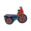 Colorful Talavera tricycle planter shown against a white background