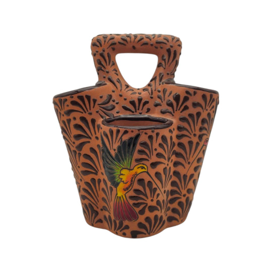 Brown Talavera utensil holder with colorful bird and relief pattern, front view