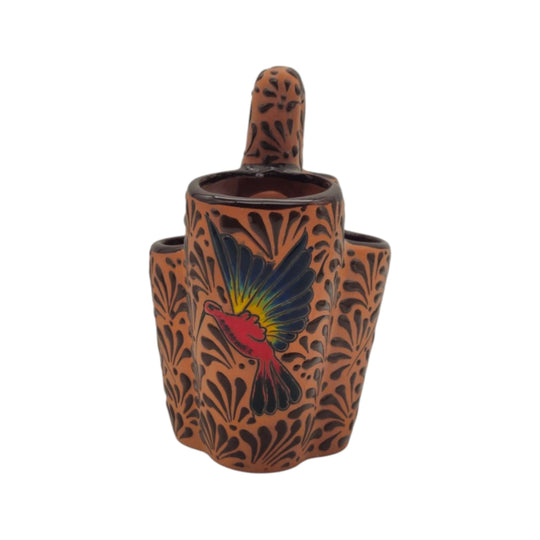Brown ceramic Talavera utensil holder showing colorful bird and raised decorative motifs