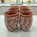 Terracotta Relief Cantarito | Handcrafted Mexican Pottery Cup — set of six hand‑painted terracotta cups with raised white floral relief