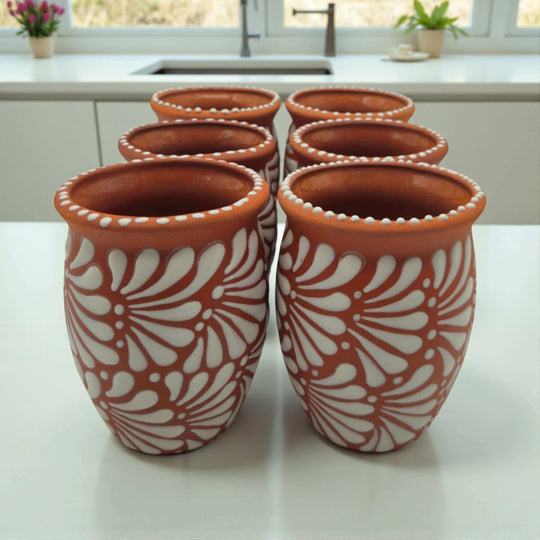 Terracotta Relief Cantarito | Handcrafted Mexican Pottery Cup — set of six hand‑painted terracotta cups with raised white floral relief