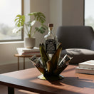 The Talavera Hub Mexican Tequila Decanter Set with 6 shot glasses, shaped like an agave plant, made of metal with green finish.