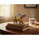 The Talavera Hub handmade ceramic Chihuahua figurine with vibrant hand-painted Mexican folk art patterns on books.