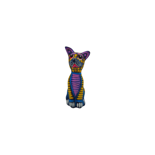 The Talavera Hub hand-painted ceramic Alebrije sitting dog statue with vibrant Mexican folk art patterns.