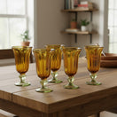 The Talavera Hub hand-blown amber glass sundae glasses with ribbed texture and green-tinted bases. Set of 6.