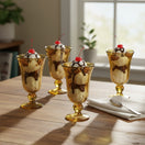 The Talavera Hub hand-blown amber glass sundae glasses with ribbed texture and green-tinted base. Set of 6.