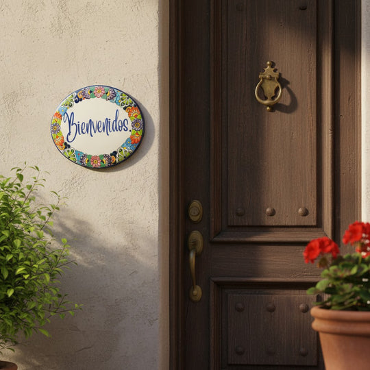 The Talavera Hub hand-painted ceramic Bienvenidos plaque with floral border, 8.25" x 10.25", ideal for entryway decor.