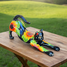 The Talavera Hub black ceramic cat statue with hand-painted sunflower design, stretching pose.