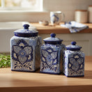 The Talavera Hub handmade blue and white ceramic canister set with traditional floral patterns on a kitchen counter.