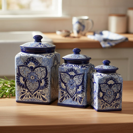 The Talavera Hub handmade blue and white ceramic canister set with traditional floral patterns on a kitchen counter.