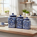 The Talavera Hub handmade blue and white ceramic canister set with traditional floral patterns on a kitchen counter.