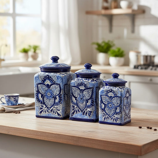 The Talavera Hub handmade blue and white ceramic canister set with traditional floral patterns on a kitchen counter.
