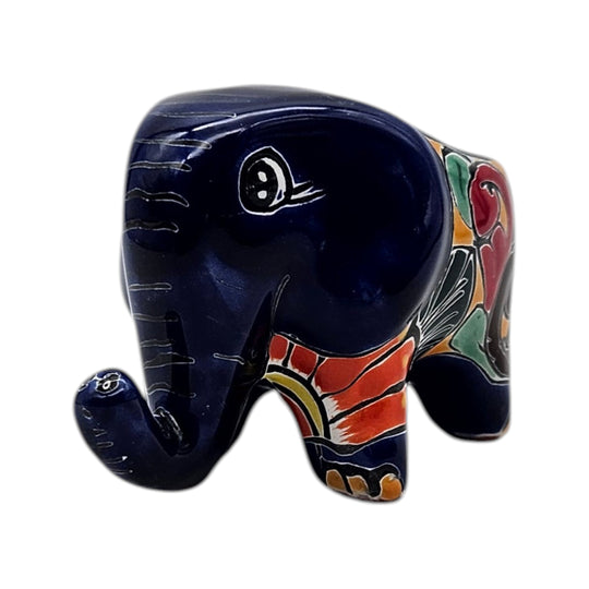The Talavera Hub hand-painted ceramic elephant planter in blue with colorful floral accents and a glossy finish.