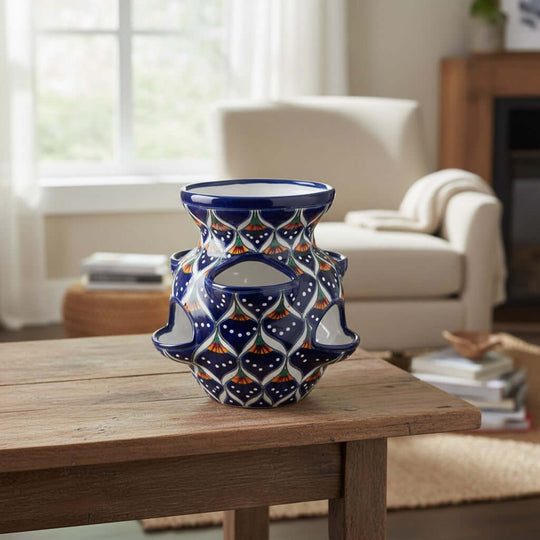The Talavera Hub blue ceramic strawberry planter with peacock design, 10.5" tall, hand-painted geometric pattern.