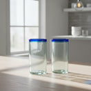 The Talavera Hub hand-blown clear glass tumblers with cobalt blue rims. Set of 2, 18 oz capacity, 6" tall.